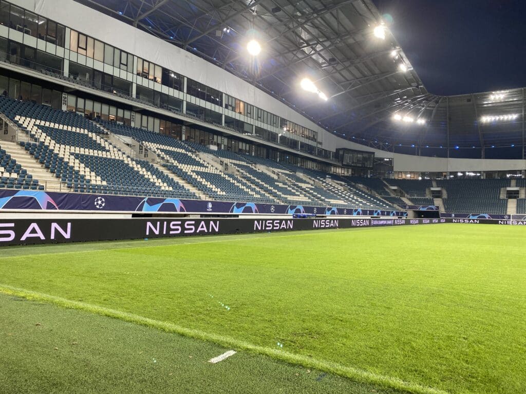 Brightboard LED boarding around the field at KAA Gent with sponsor advertising.
